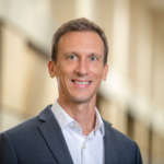 A headshot photograph of Zoltán I. Búzás